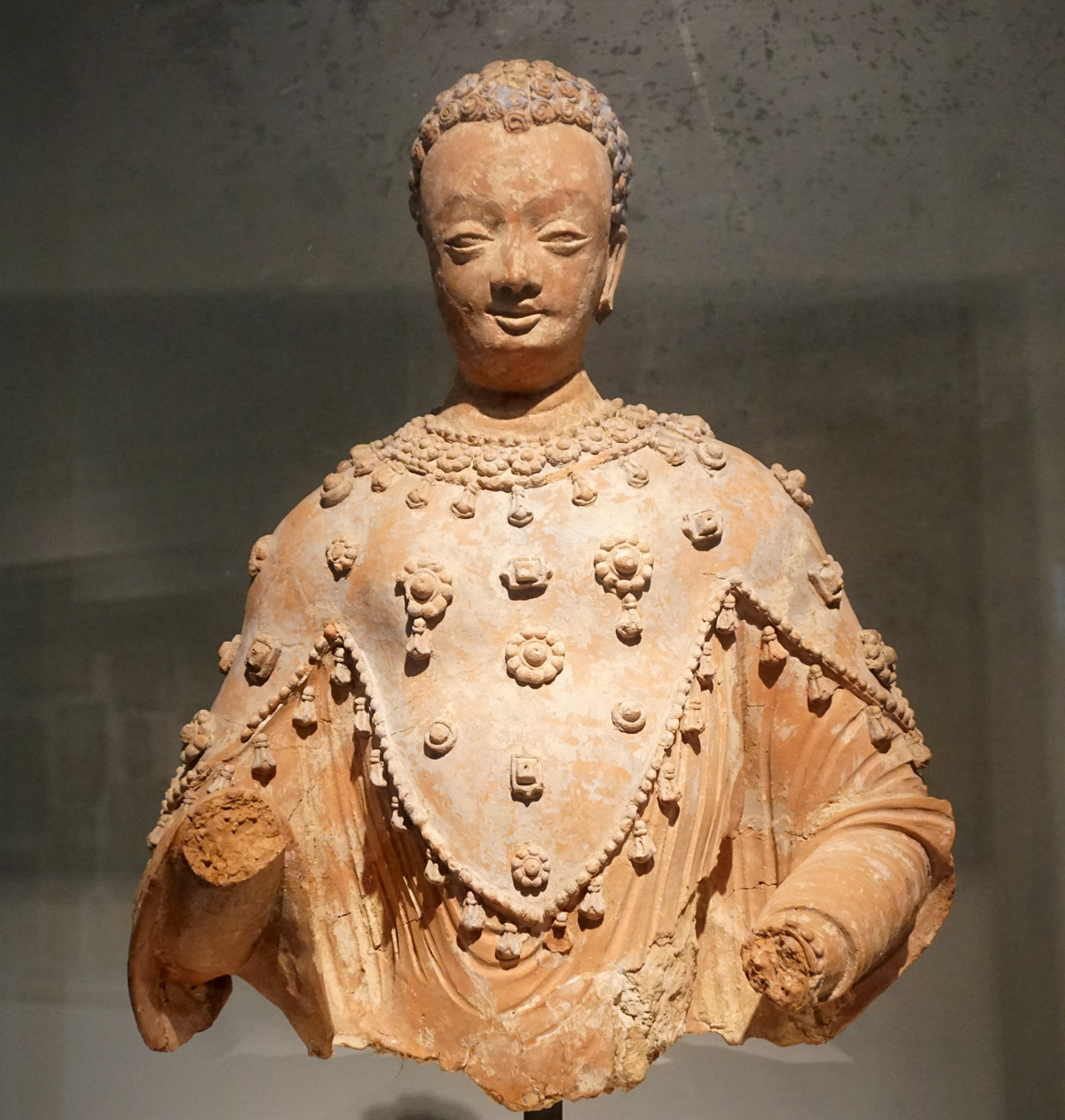 Buddha adorned with three-cornered cloak