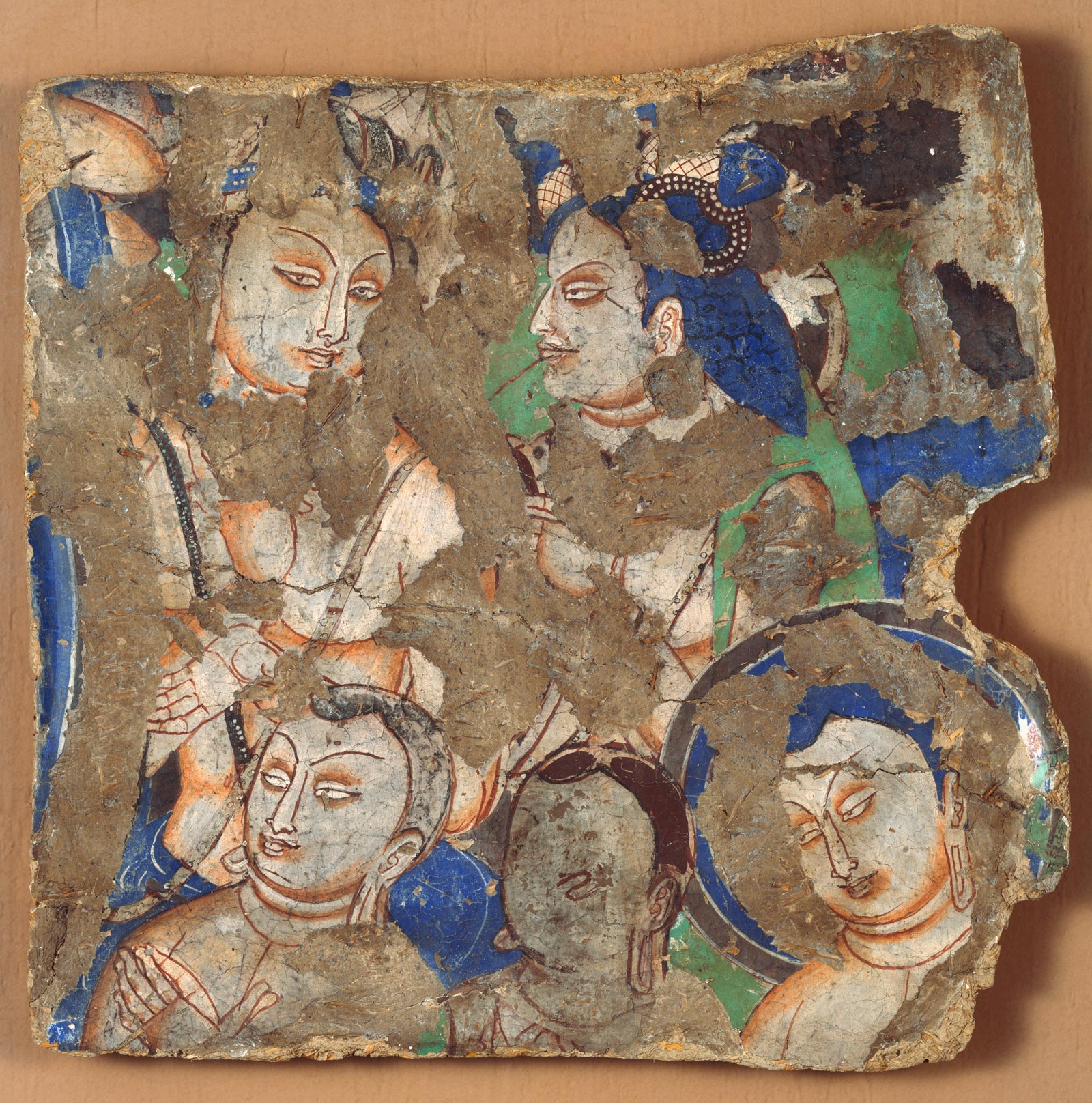 Mural fragment depicting an audience listening to the Buddha preaching